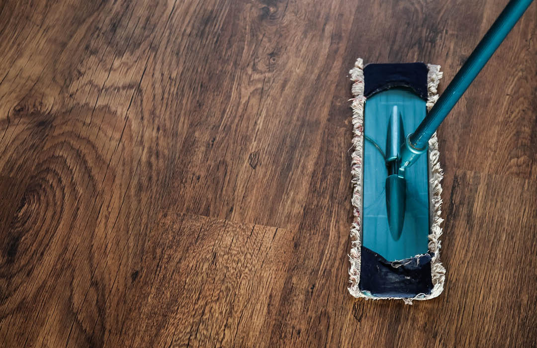 Carpet and Floor Care - a wooden floor being cleaned.