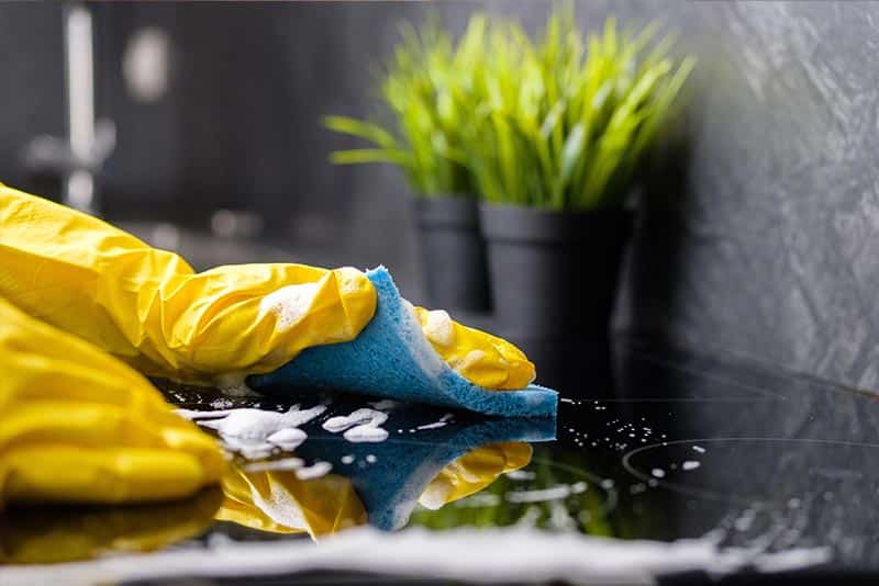 cleaning kitchen worktop